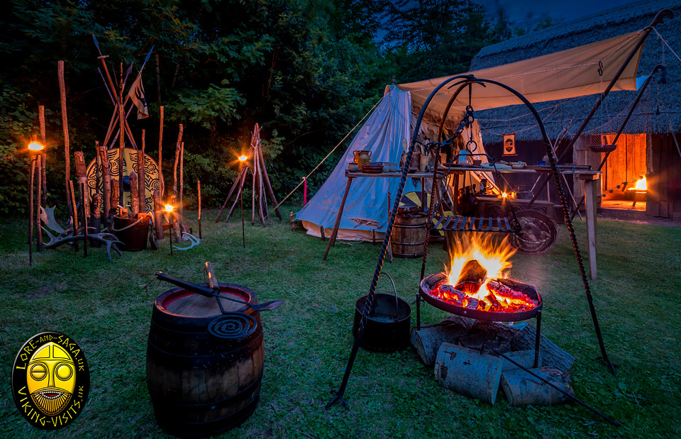 Viking Living History Camp at night by a Longhouse - Image copyrighted  Gary Waidson. All rights reserved.